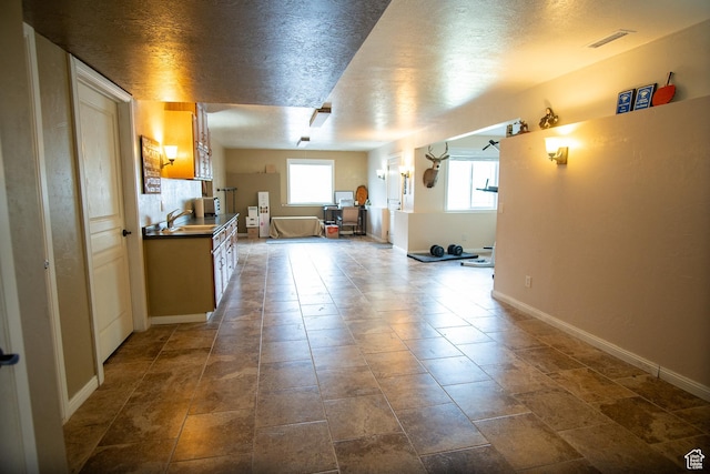 159 S 400 E, Annabella, UT 84711 - kitchen featuring dark countertops, baseboards, and a sink
