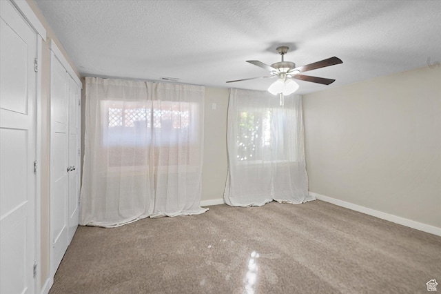 4487 W Tee Box Dr, South Jordan, UT 84009 - unfurnished bedroom featuring a textured ceiling, baseboards, and ceiling fan