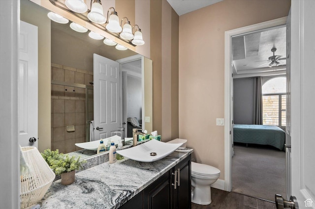 4487 W Tee Box Dr, South Jordan, UT 84009 - bathroom with ensuite bath, wood finished floors, vanity, tiled shower, and toilet