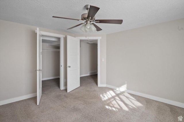 4487 W Tee Box Dr, South Jordan, UT 84009 - unfurnished bedroom featuring a textured ceiling, carpet flooring, baseboards, a closet, and ceiling fan