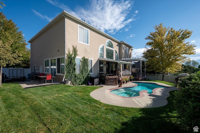 4487 W Tee Box Dr, South Jordan, UT 84009 - rear view of property with a wooden deck, stucco siding, a patio, a pool with connected hot tub, and a pergola