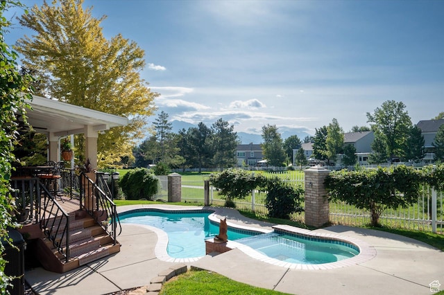 4487 W Tee Box Dr, South Jordan, UT 84009 - view of swimming pool with a fenced backyard, a pool with connected hot tub, and a patio area