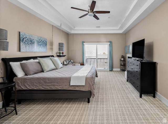 4487 W Tee Box Dr, South Jordan, UT 84009 - bedroom featuring a raised ceiling, light carpet, baseboards, and a ceiling fan
