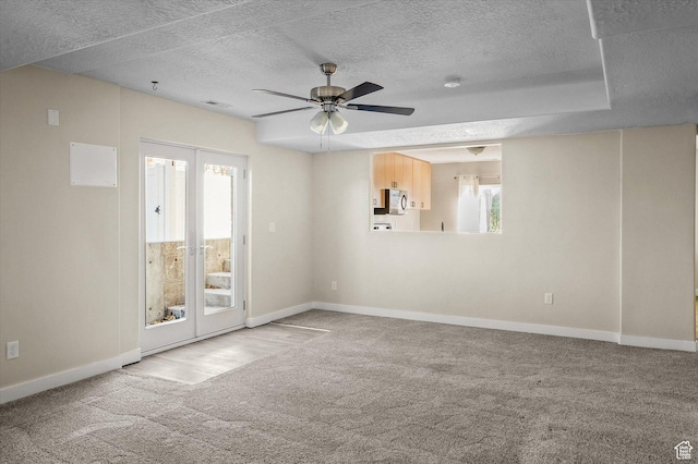 4487 W Tee Box Dr, South Jordan, UT 84009 - unfurnished room featuring carpet floors, baseboards, french doors, ceiling fan, and a textured ceiling