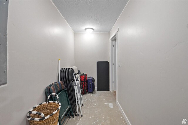 4487 W Tee Box Dr, South Jordan, UT 84009 - corridor featuring a textured ceiling