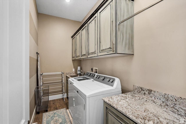 4487 W Tee Box Dr, South Jordan, UT 84009 - laundry area with cabinet space, washer and clothes dryer, wood finished floors, and baseboards