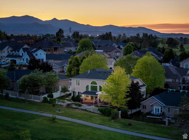 4487 W Tee Box Dr, South Jordan, UT 84009 - aerial view at dusk of a residential view and a mountain view