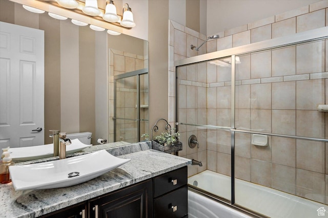 4487 W Tee Box Dr, South Jordan, UT 84009 - bathroom with vanity, combined bath / shower with glass door, and toilet