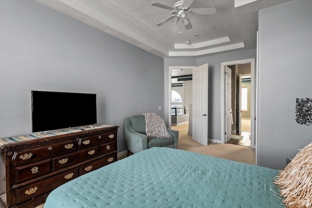 4487 W Tee Box Dr, South Jordan, UT 84009 - bedroom with a raised ceiling, light carpet, baseboards, and a ceiling fan