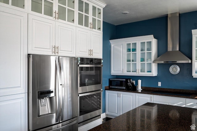 4487 W Tee Box Dr, South Jordan, UT 84009 - kitchen with stainless steel appliances, wall chimney exhaust hood, white cabinets, and glass insert cabinets