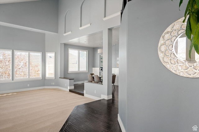 4487 W Tee Box Dr, South Jordan, UT 84009 - foyer entrance with wood finished floors, baseboards, and a towering ceiling