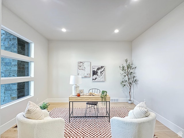 office space with light wood-type flooring
