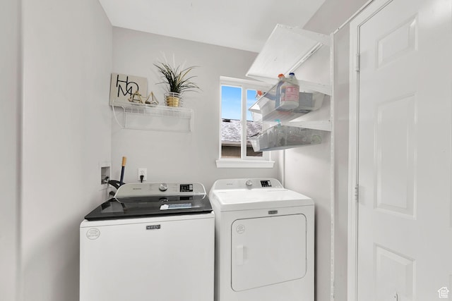 laundry area featuring washing machine and clothes dryer and laundry area