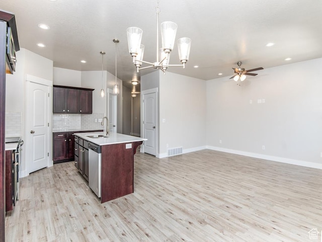 16297 S Truss Dr Unit 614, Bluffdale, UT 84065 - kitchen with a kitchen island with sink, appliances with stainless steel finishes, hanging light fixtures, and light hardwood / wood-style floors