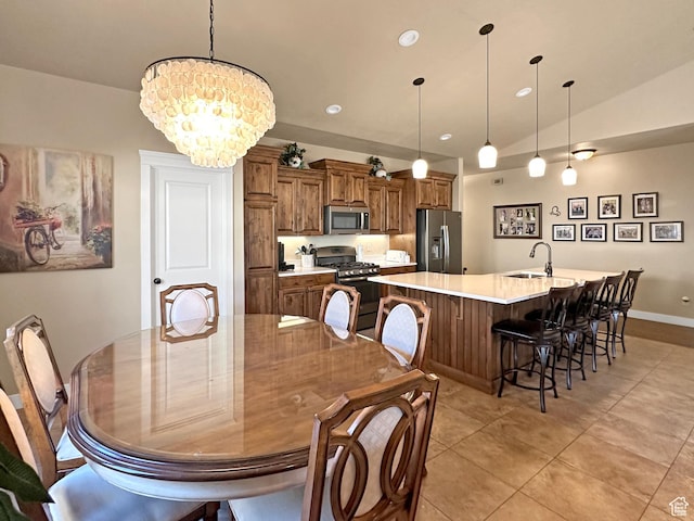 1313 N 250 E, Brigham City, UT 84302 - dining area with light tile patterned floors, a chandelier, recessed lighting, baseboards, and vaulted ceiling