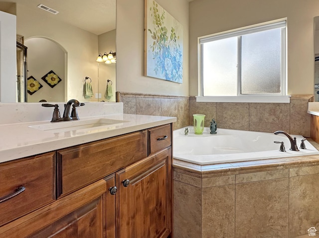 1313 N 250 E, Brigham City, UT 84302 - bathroom with vanity, a garden tub, and a shower with door