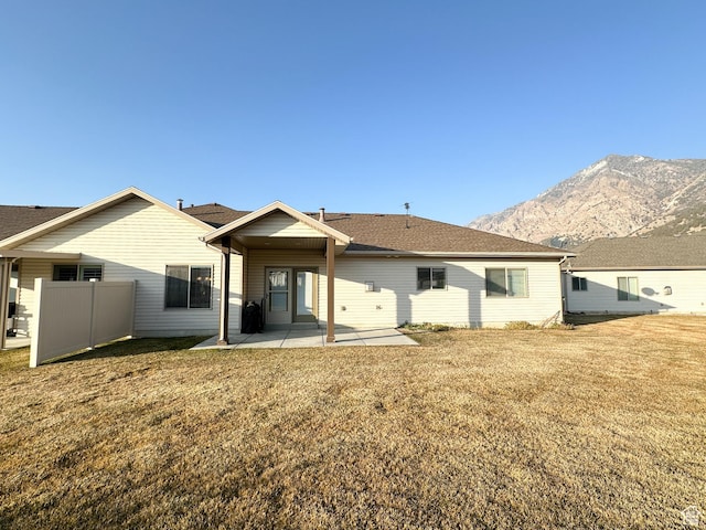 52 E 1300 N, Brigham City, UT 84302 - back of house featuring a patio area, a mountain view, and a yard