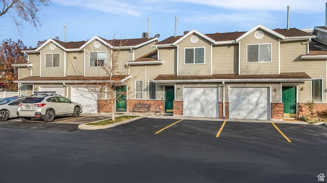 townhome / multi-family property with a garage