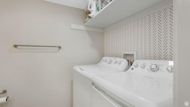 clothes washing area featuring washing machine and clothes dryer