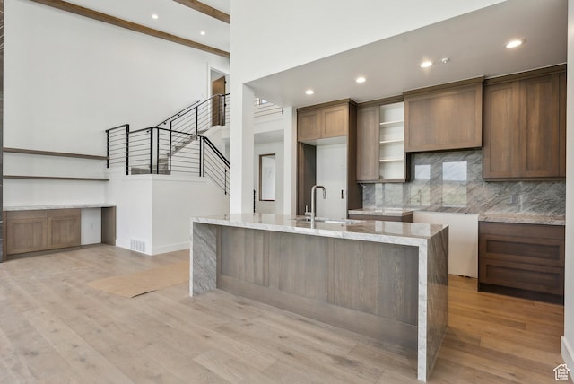 5758 Cobalt Cir Unit 12, Park City, UT 84098 - kitchen featuring a sink, tasteful backsplash, light stone counters, light wood finished floors, and recessed lighting