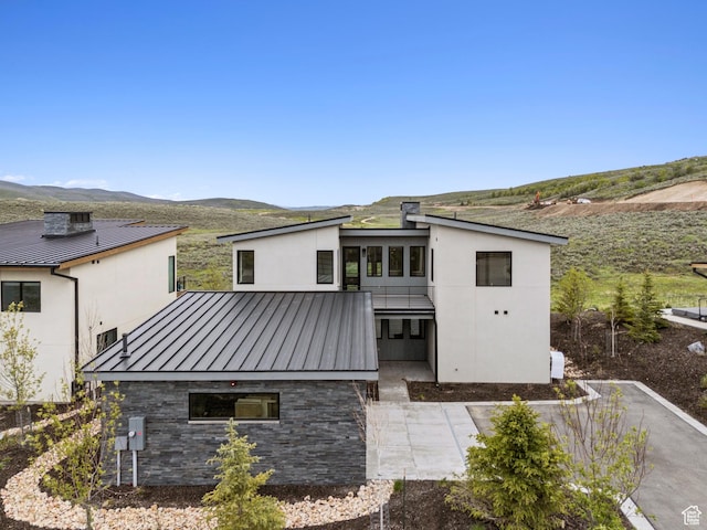 5758 Cobalt Cir Unit 12, Park City, UT 84098 - back of house with a standing seam roof, a mountain view, metal roof, and stucco siding