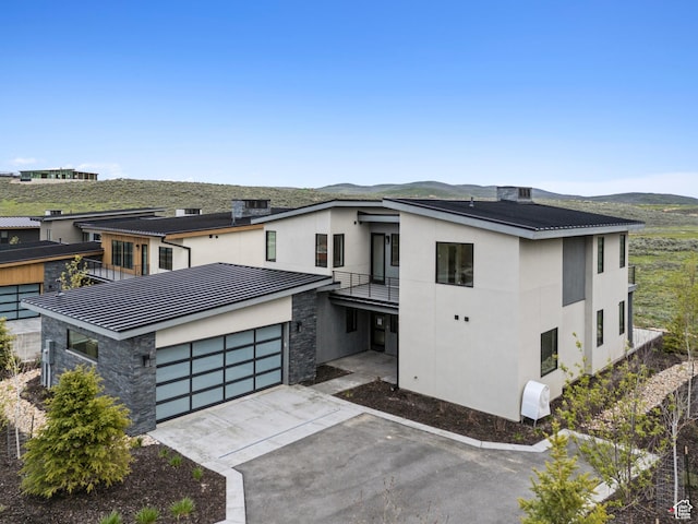 5758 Cobalt Cir Unit 12, Park City, UT 84098 - contemporary house with stone siding, a balcony, stucco siding, driveway, and a mountain view