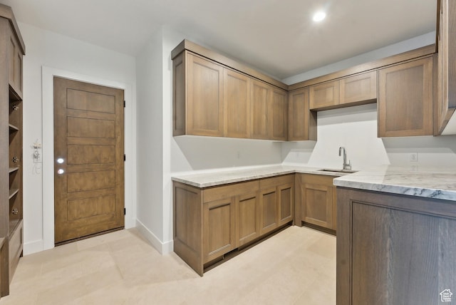 5758 Cobalt Cir Unit 12, Park City, UT 84098 - kitchen with light stone counters, a sink, and baseboards
