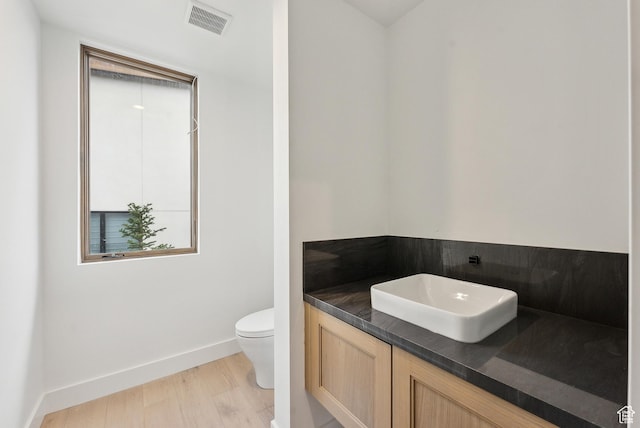 5758 Cobalt Cir Unit 12, Park City, UT 84098 - half bathroom with toilet, baseboards, wood finished floors, and vanity