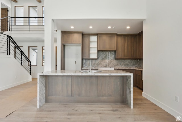 5758 Cobalt Cir Unit 12, Park City, UT 84098 - kitchen with a sink, decorative backsplash, baseboards, recessed lighting, and light stone counters