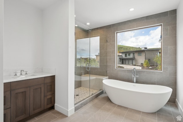 5758 Cobalt Cir Unit 12, Park City, UT 84098 - full bathroom with tile walls, a shower stall, recessed lighting, a freestanding bath, and tile patterned flooring