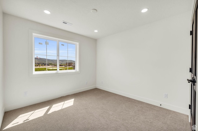 1333 Sage Way Unit 45, Francis, UT 84036 - empty room featuring a mountain view and light carpet