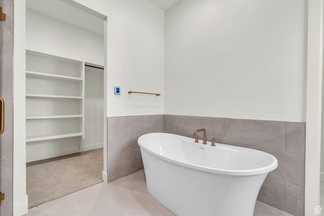 1333 Sage Way Unit 45, Francis, UT 84036 - bathroom featuring a bathing tub, tile walls, and tile patterned floors