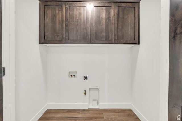 1333 Sage Way Unit 45, Francis, UT 84036 - washroom featuring cabinets, hookup for an electric dryer, gas dryer hookup, hookup for a washing machine, and hardwood / wood-style floors