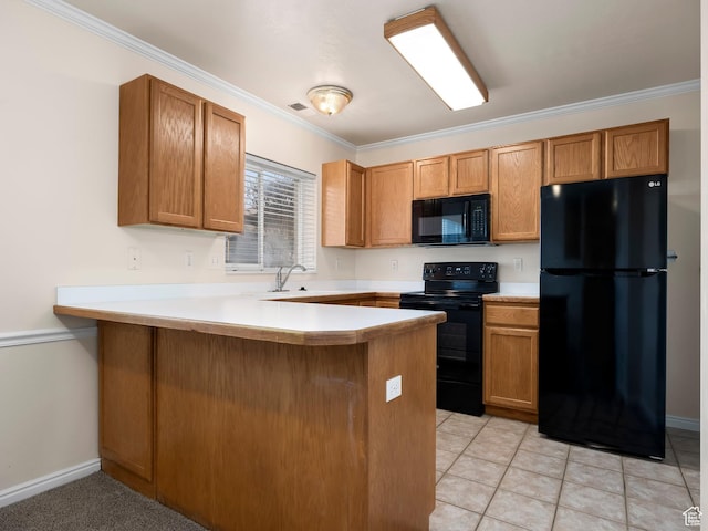 kitchen with crown molding, a peninsula, visible vents, black appliances, and light countertops