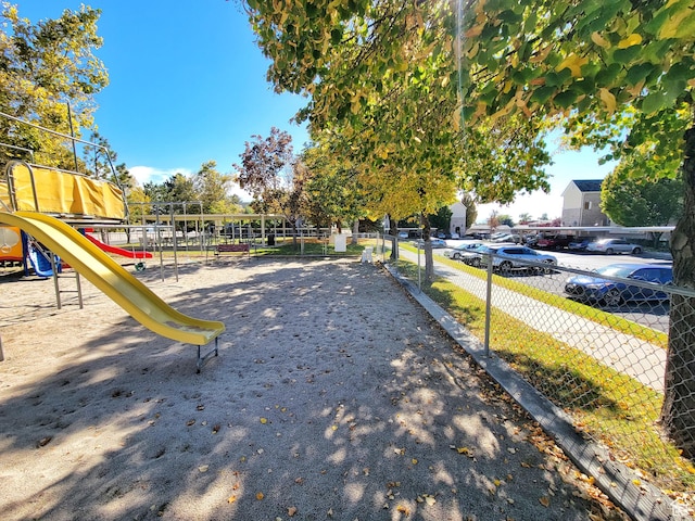 exterior space with playground community and fence