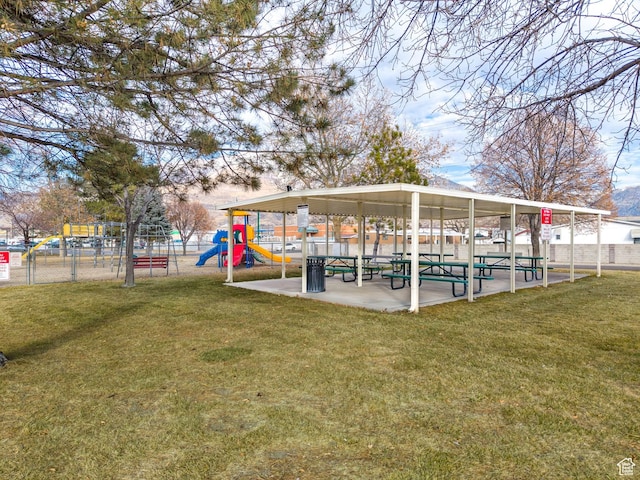 exterior space featuring fence and playground community