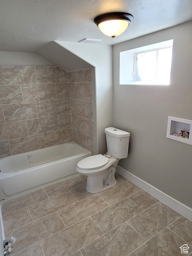 bathroom with tile patterned floors and toilet