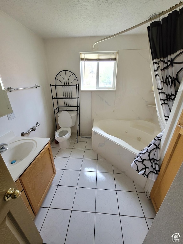 636 E 300 N, American Fork, UT 84003 - bathroom featuring vanity, a combined bath / shower with jetted tub, toilet, tile patterned floors, and a textured ceiling
