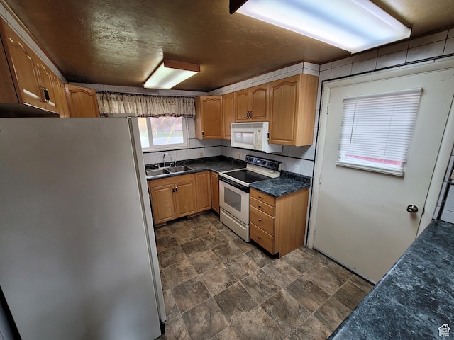 636 E 300 N, American Fork, UT 84003 - kitchen featuring freestanding refrigerator, electric stove, white microwave, a sink, and stone finish flooring