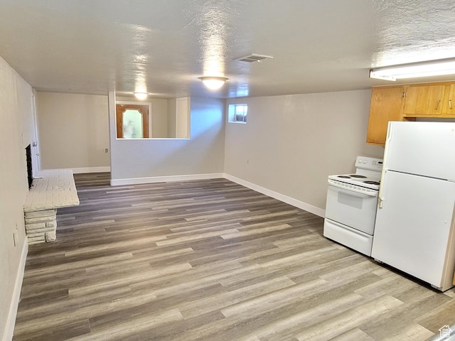 636 E 300 N, American Fork, UT 84003 - kitchen with white appliances, wood finished floors, baseboards, and light brown cabinetry