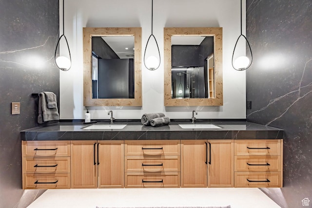 bathroom with double vanity and a sink