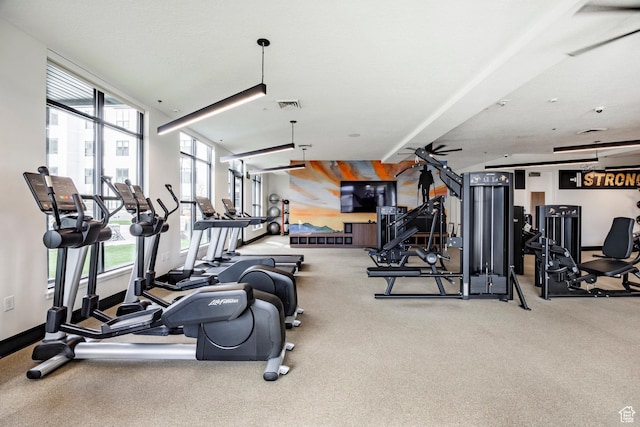 exercise room featuring visible vents and carpet floors