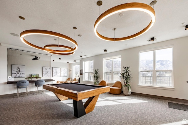 playroom with billiards, a raised ceiling, and baseboards