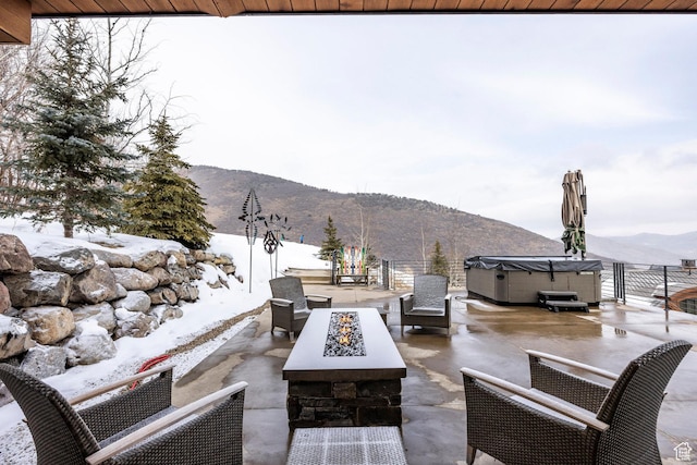2848 W Deer Pointe Dr, Park City, UT 84060 - view of patio / terrace featuring a hot tub, a mountain view, and an outdoor living space with a fire pit