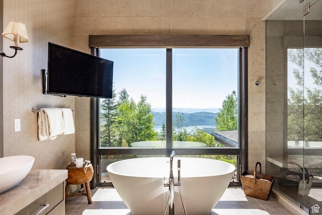 2848 W Deer Pointe Dr, Park City, UT 84060 - full bath with a soaking tub, tile patterned floors, a shower stall, and vanity