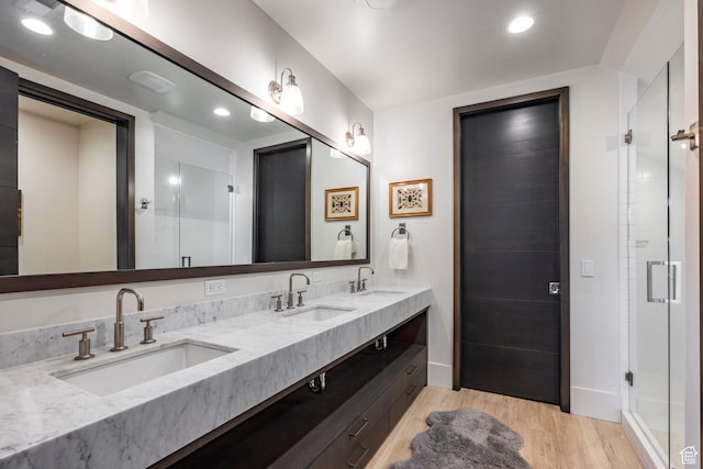 2848 W Deer Pointe Dr, Park City, UT 84060 - full bathroom featuring wood finished floors, a shower stall, baseboards, double vanity, and recessed lighting