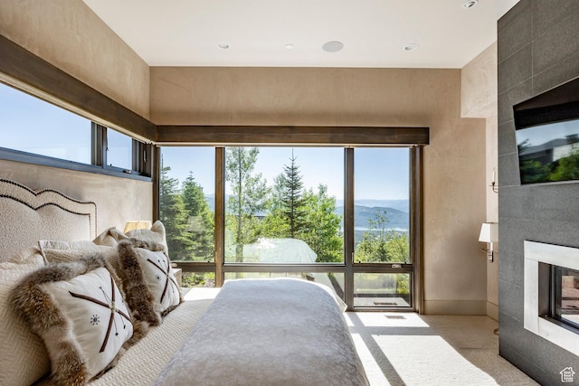 2848 W Deer Pointe Dr, Park City, UT 84060 - carpeted bedroom with a tile fireplace and recessed lighting