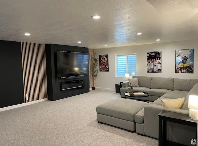 living room featuring carpet flooring and a textured ceiling