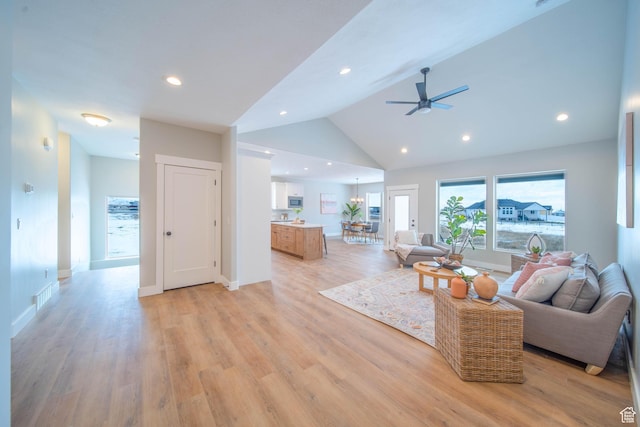 1436 E Parker Ln Unit 426, Lake Point, UT 84074 - living room with light wood finished floors, vaulted ceiling, recessed lighting, and ceiling fan