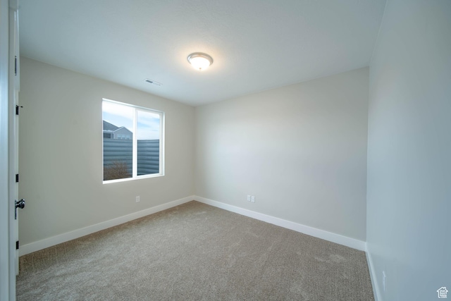 1436 E Parker Ln Unit 426, Lake Point, UT 84074 - spare room featuring visible vents, baseboards, and carpet floors